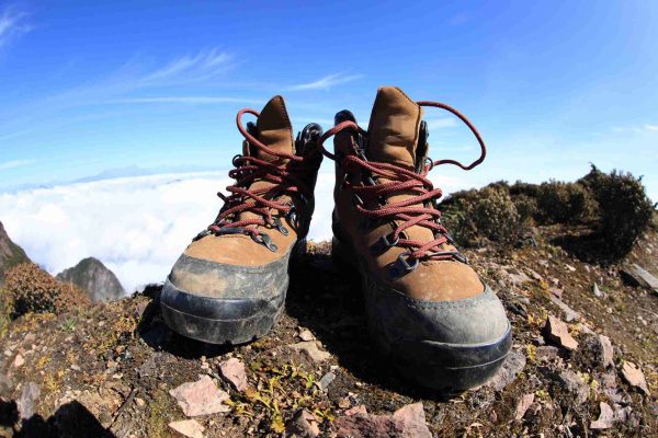 hiking boots on beautiful mountain peak
