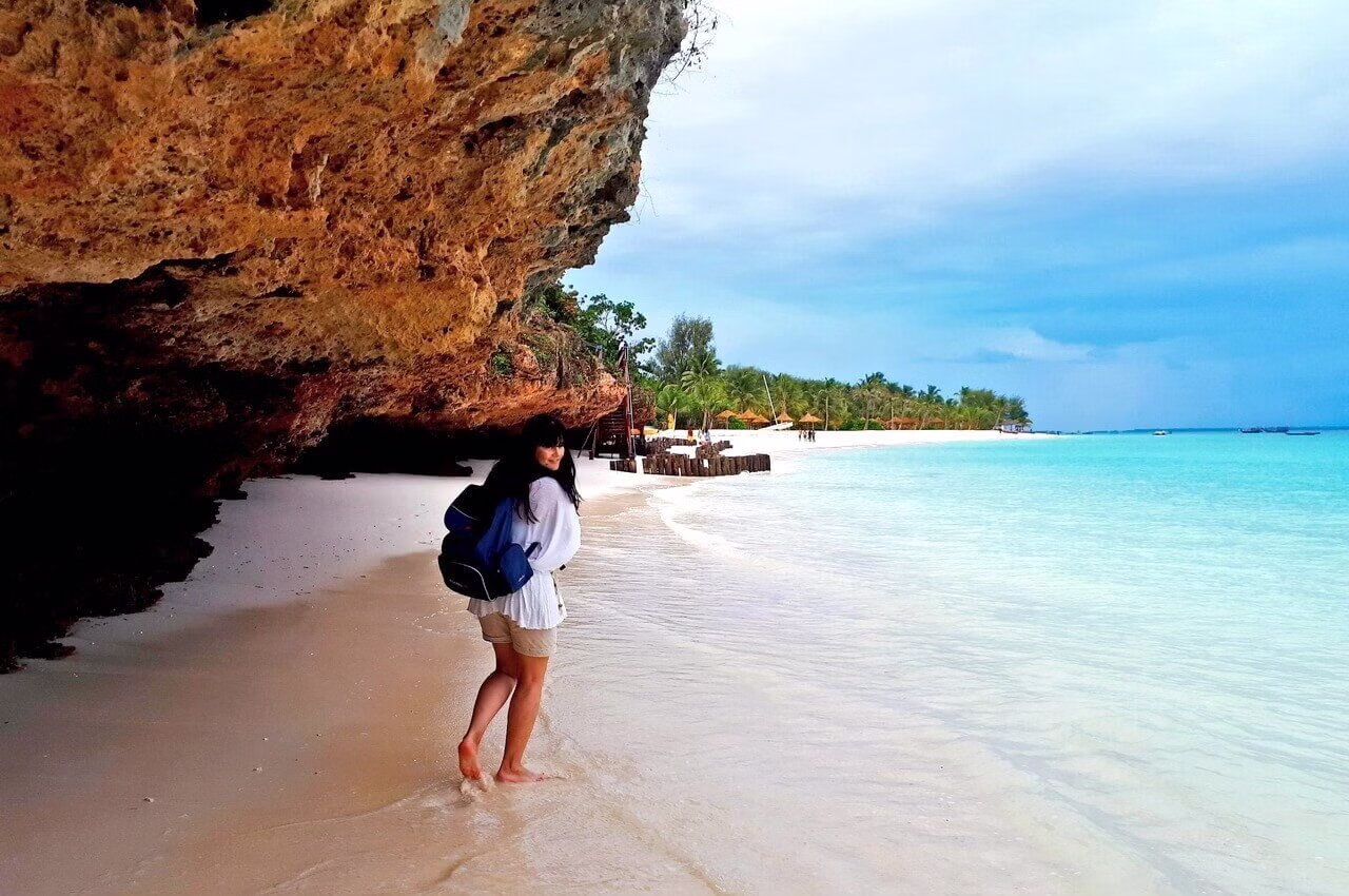A white-sand beach below coral cliffs, Zanzibar