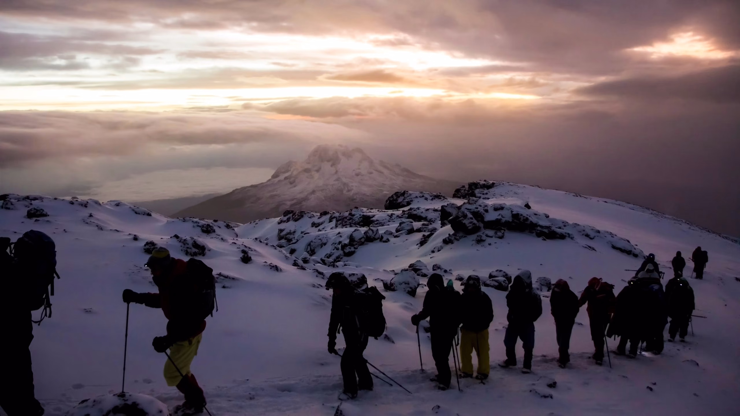 Climbers crossing snow high on Kilimanjaro